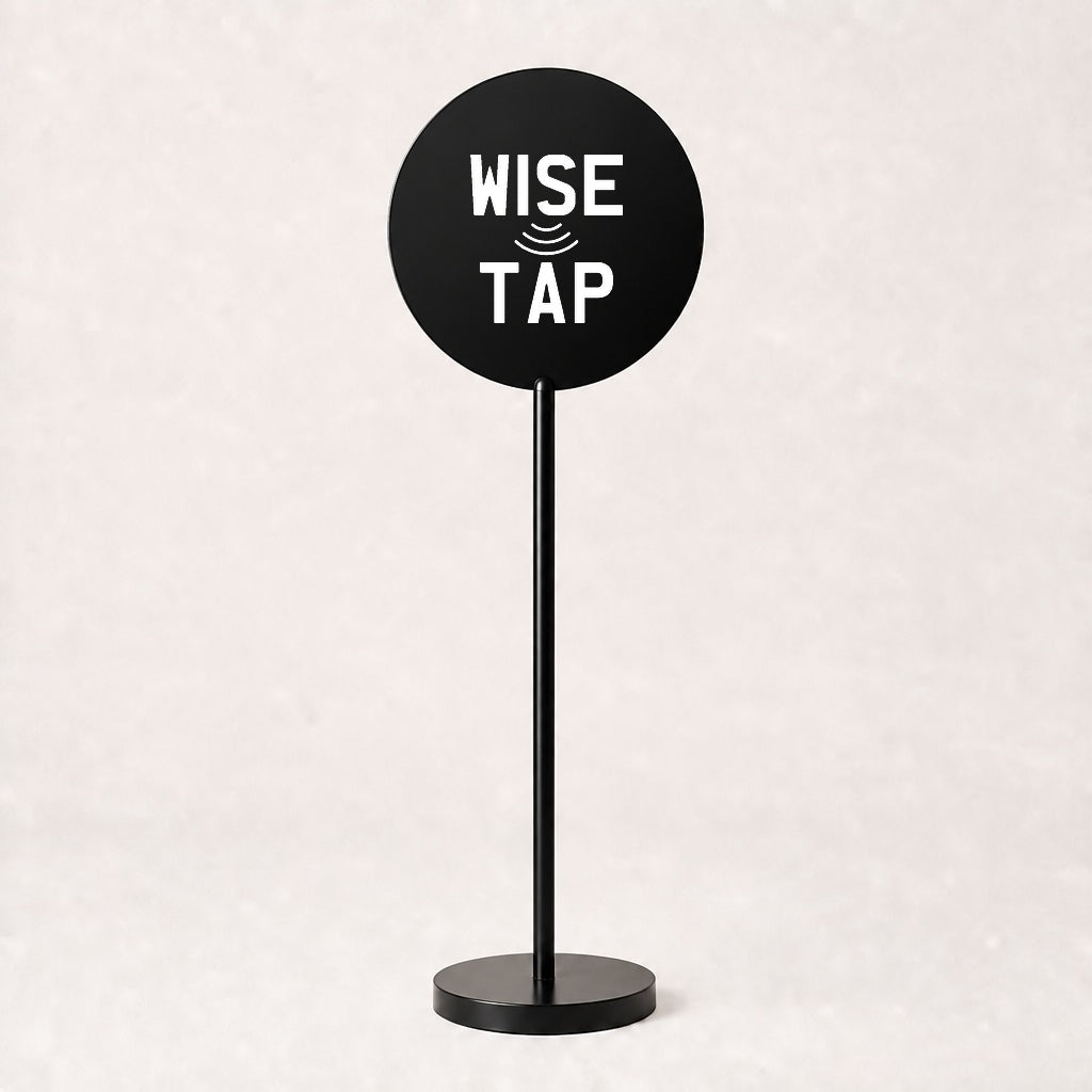 Custom acrylic floor sign in Black with WiseTap stacked logo centred on the disc, 120cm stand