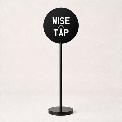 Custom acrylic floor sign in Black with WiseTap stacked logo centred on the disc, 120cm stand