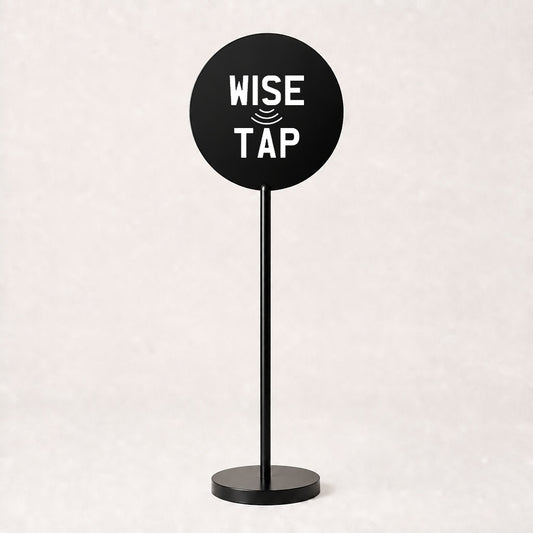 Custom acrylic floor sign in Black with WiseTap stacked logo centred on the disc, 120cm stand